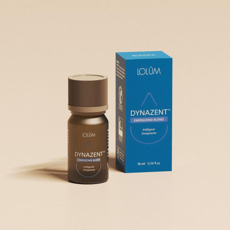 Mélange revitalisant DYNAZENT™ placé sur fond neutre – huile essentielle boost énergie.