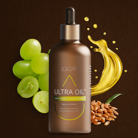 Flacon ULTRA OIL Antioxidant & Brightening avec huiles végétales et ingrédients naturels comme le raisin et le lin, présenté sur fond naturel.